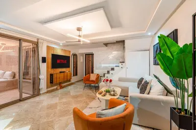 a living room with a couch and a table at Marrakech Duplex Spacieux avec Terrasse in Marrakech