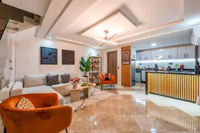 a living room with a couch and a table at Marrakech Duplex Spacieux avec Terrasse in Marrakech