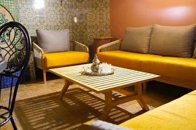 a living room with a couch and a coffee table at duplex a Gueliz in Marrakech