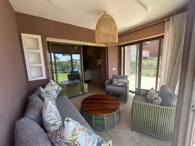 a living room with a couch and a table at Relax appartement in Marrakech