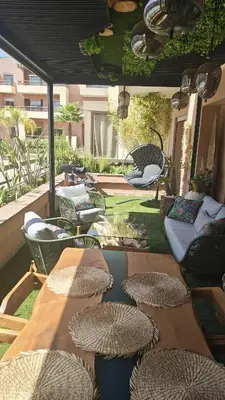 a group of tables and chairs on a patio at Whispers of NATURE in Marrakech