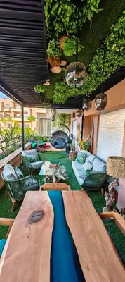 a living room with a table and chairs and sidx sidx sidx at Whispers of NATURE in Marrakech