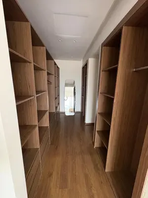 a hallway with wooden shelves in a room at Villa del Sur 5 min du centre in Marrakech