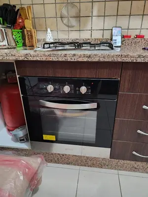 a kitchen with a stove and a counter top at Comfortable apartment for families in Marrakech