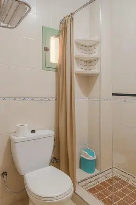 a bathroom with a toilet and a shower at Bright 2-BR - Balcony & Parking - Fast Wi-Fi - Near Route de Casa in Marrakech
