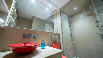 a bathroom with a red sink and a shower at Chic City Studio in Marrakech in Marrakech