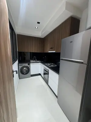 a kitchen with a refrigerator and a dishwasher at Menara Garden - 3 Ch - Piscine - 2 min de M Avenue in Marrakech