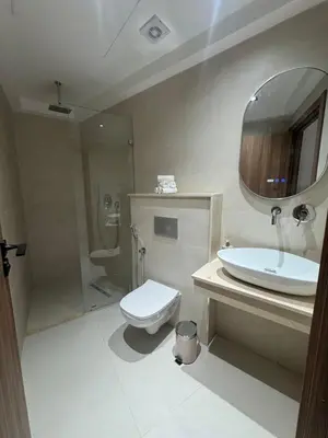 a bathroom with a toilet and a sink and a mirror at Menara Garden - 3 Ch - Piscine - 2 min de M Avenue in Marrakech