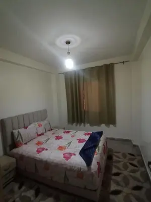 a bedroom with a bed and a window at Menara Airport Appartement - 10 Min Walk in Marrakech