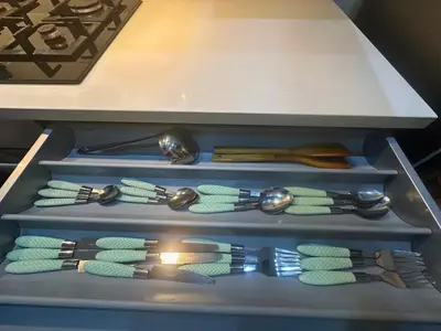 a drawer full of utensils in a kitchen at Appartement de Luxe avec Piscine et Jacuzzi Marrakech in Marrakech