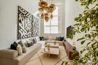 a living room with a couch and a table at L'Elara - Semlalia - Duplex - Piscine in Marrakech