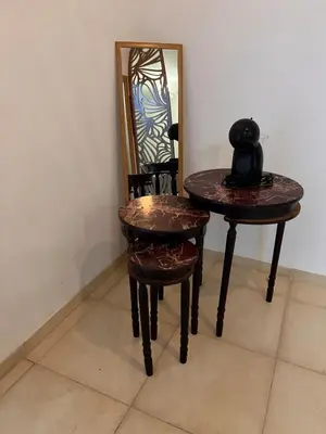 a table and a chair and a mirror in a room at New, quiet and comfortable in Marrakech