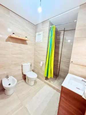 a bathroom with a toilet and a sink and a shower at N1 Moderne Confortable FAMILY Près De Gueliz in Marrakech