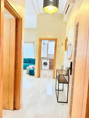 a living room with a hallway with a table at N1 Moderne Confortable FAMILY Près De Gueliz in Marrakech