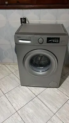 a washing machine sitting on a tile floor at Beautiful, very quiet apartment in Marrakech