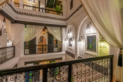 a staircase in a home with wrought iron railing at Dar Bonita in Marrakech
