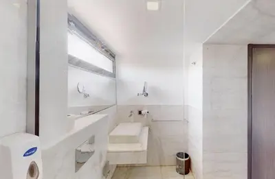 a white bathroom with a sink and a toilet at Duplex Premium 3 Suites, Style Villa, Terrasse & Accès direct piscine, Oliver Palm Resort Marrakech in Marrakech