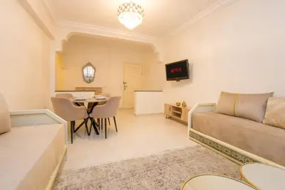 a living room with a couch and a table at Charming Majorelle Apartment in Marrakech