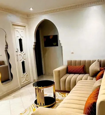 a living room with a couch and a table at Hide & seek in Marrakech