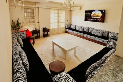 a living room with two couches and a table at Hide & seek in Marrakech