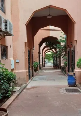 an empty alley with an archway in a building at Le riad de Daba in Marrakech