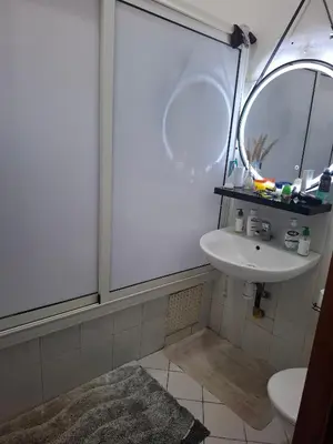 a bathroom with a sink and a mirror at Le riad de Daba in Marrakech