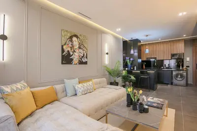 a living room with a couch and a table at Luxury Designer Apartment Central Marrakech in Marrakech