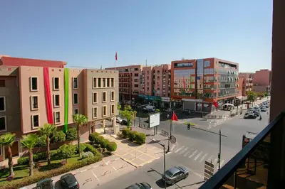 a view of a city with buildings and a street at Luxury Designer Apartment Central Marrakech in Marrakech