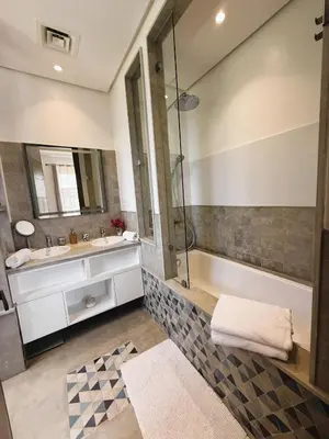 a bathroom with a sink and a shower at Villa Marrazen, lovely villa -housestaff included in Marrakech
