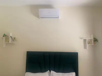 a room with a white air conditioner on the wall at Appartement diar Marjane in Marrakech