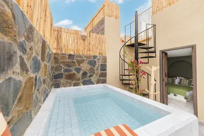 a swimming pool in the middle of a house at Stylish and Exclusive Riad Saada with Pool and free Breakfast in Marrakech