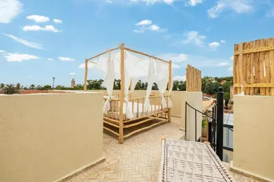 a gazebo on the roof of a house at Stylish and Exclusive Riad Saada with Pool and free Breakfast in Marrakech