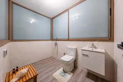a bathroom with a toilet and a sink at Marrakech Centre Ville Rooftop & Espace Fitness in Marrakech