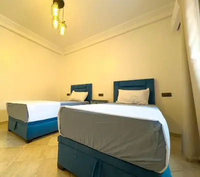 two beds in a room with two bedsvisor at Apart 2-Bedrooms Centre of Marrakech-Medina place in Marrakech