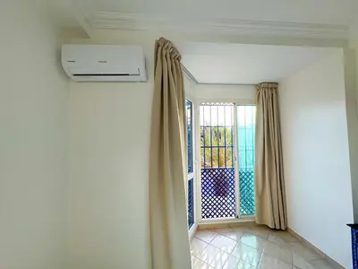 an empty room with a window with curtains and a window at Apart 2-Bedrooms Centre of Marrakech-Medina place in Marrakech