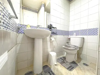 a bathroom with a sink and a toilet at Apart 2-Bedrooms Centre of Marrakech-Medina place in Marrakech
