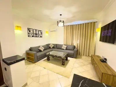 a living room with a couch and a table at Apart 2-Bedrooms Centre of Marrakech-Medina place in Marrakech