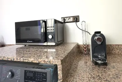 a counter with a microwave and a toaster oven on it at Apart 2-Bedrooms Centre of Marrakech-Medina place in Marrakech