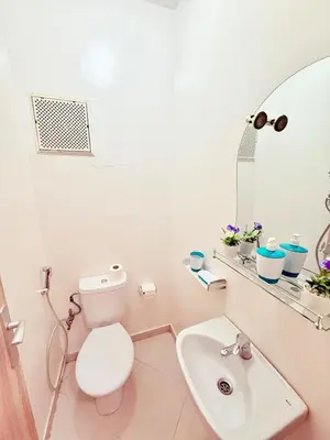 a bathroom with a white toilet and a sink at N9 Parfait Top Près De Gueliz in Marrakech