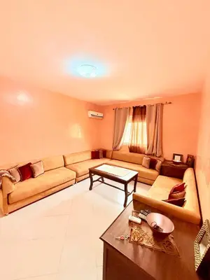 a living room with a couch and a table at N9 Parfait Top Près De Gueliz in Marrakech