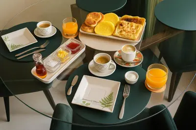 a table with a tray of breakfast foods and cups of coffee at Bloom Hivernage Deluxe - 2 Chambres - Le Soleil en Mars - Petit déjeuner et Services de chambres inclus - A 10mn des sites - Balcon végétal in Marrakech