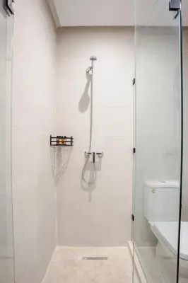 a shower with a glass door in a bathroom at Âme Berbère Piscine Privée in Marrakech