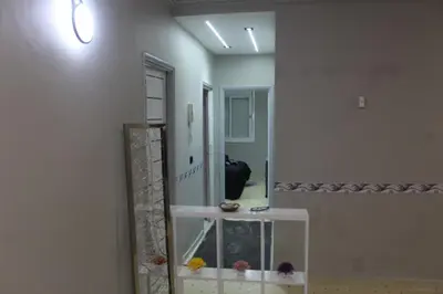 a hallway with a large mirror and a room at Appartement mamá MK in Marrakech