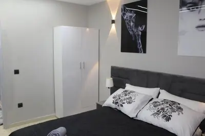 a bedroom with a bed with two pillows on it at Appartement mamá MK in Marrakech
