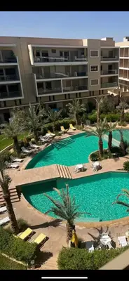 an overhead view of a swimming pool in a building at Perle garden in Marrakech