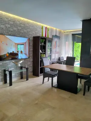 a living room with a table and chairs at Pavillon Luxe - Jardin de l'Atlas - Golf & Waky in Sraghna