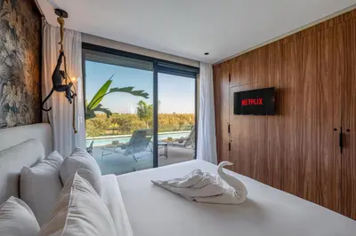 a bedroom with a bed with a swan decoration on it at Villa Simone in Marrakech