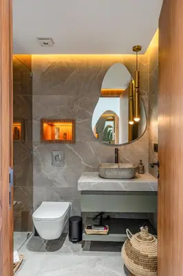 a bathroom with a sink and a toilet and a mirror at Villa Simone in Marrakech