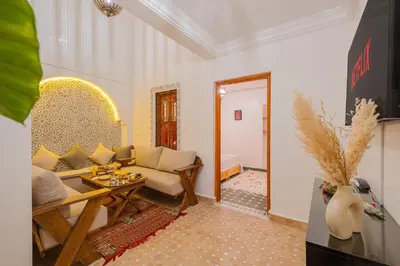 a living room with a couch and a table at Riad Dar Z'r in Marrakech