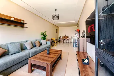 a living room with a couch and a coffee table at Rent Appartment In Marrakesh - Morocco - Semlalia in Marrakech